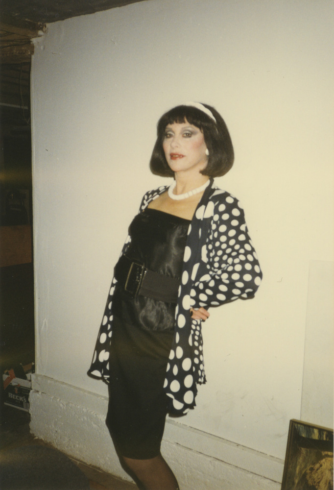 Download the full-sized image of Photograph of Alexis Francois in Black and White Polka Dot Cardigan and Black Belt