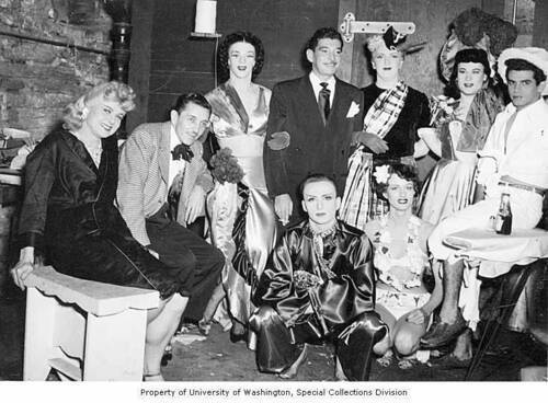 Download the full-sized image of Gita Gilmore, Doc Brenner, Danny Brown and Paris DeLaire with a group of men and women, Jewel Box Revue