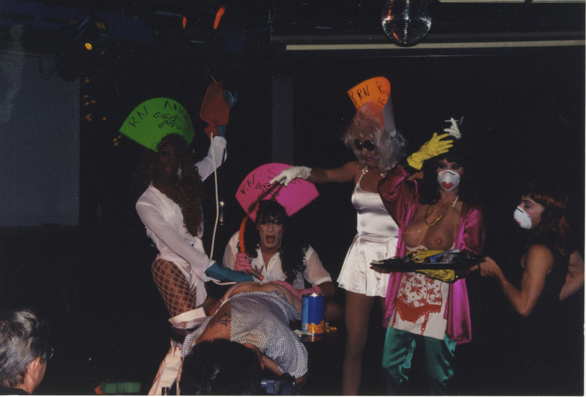 Download the full-sized image of Photograph of Alexis Francois at Drag Show Performing Rectal Exam