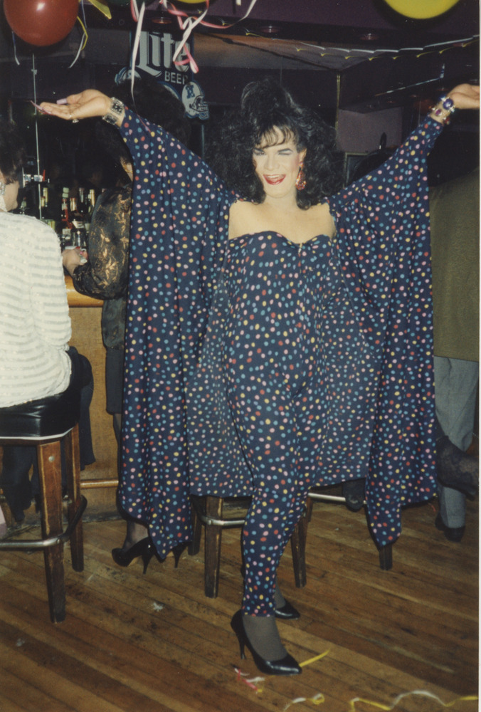 Download the full-sized image of Photograph of Person Smiling in Dotted Navy Jumpsuit