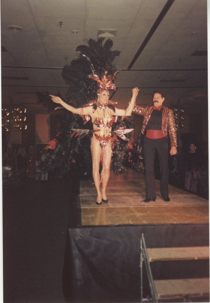 Download the full-sized image of Photograph of Person on Stage in Showgirl Outfit