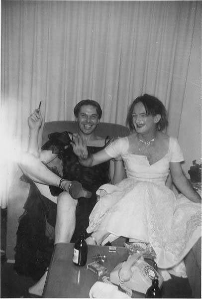 Download the full-sized image of Two unknown femmes sitting and smoking at a house party