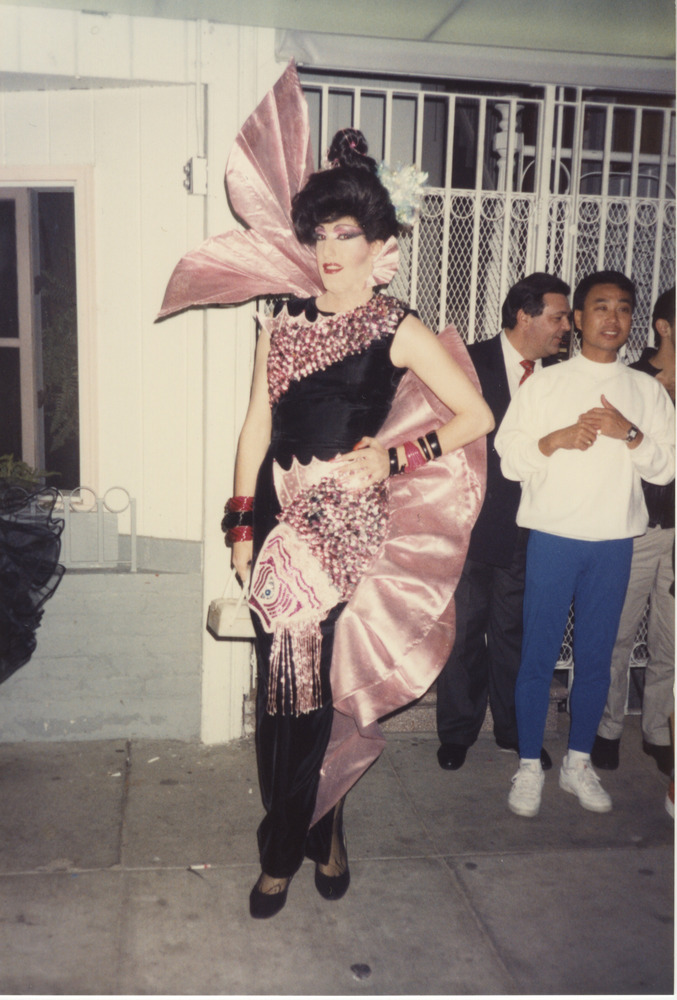 Download the full-sized image of Photograph of Person in Black and Pink Dress with Ruffle Detail