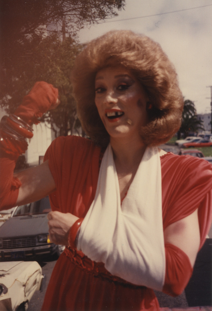 Download the full-sized image of Photograph of Alexis Francois in Red Dress and Arm Sling