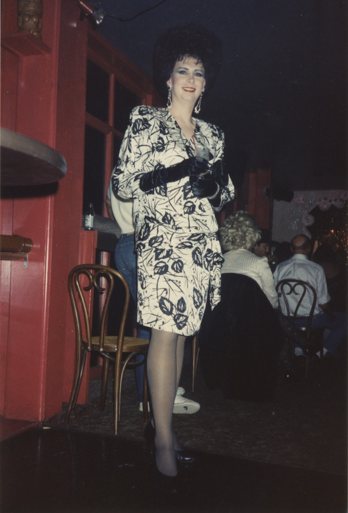 Download the full-sized image of Photograph of Person in Black and White Leaf Pattern Wrap Dress