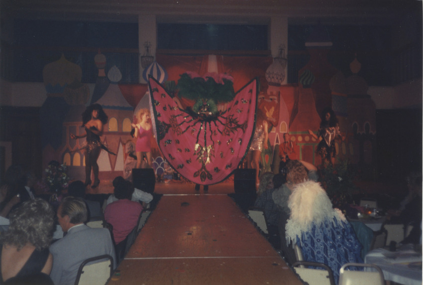 Download the full-sized image of Photograph of People Performing on Stage with Castle Backdrop