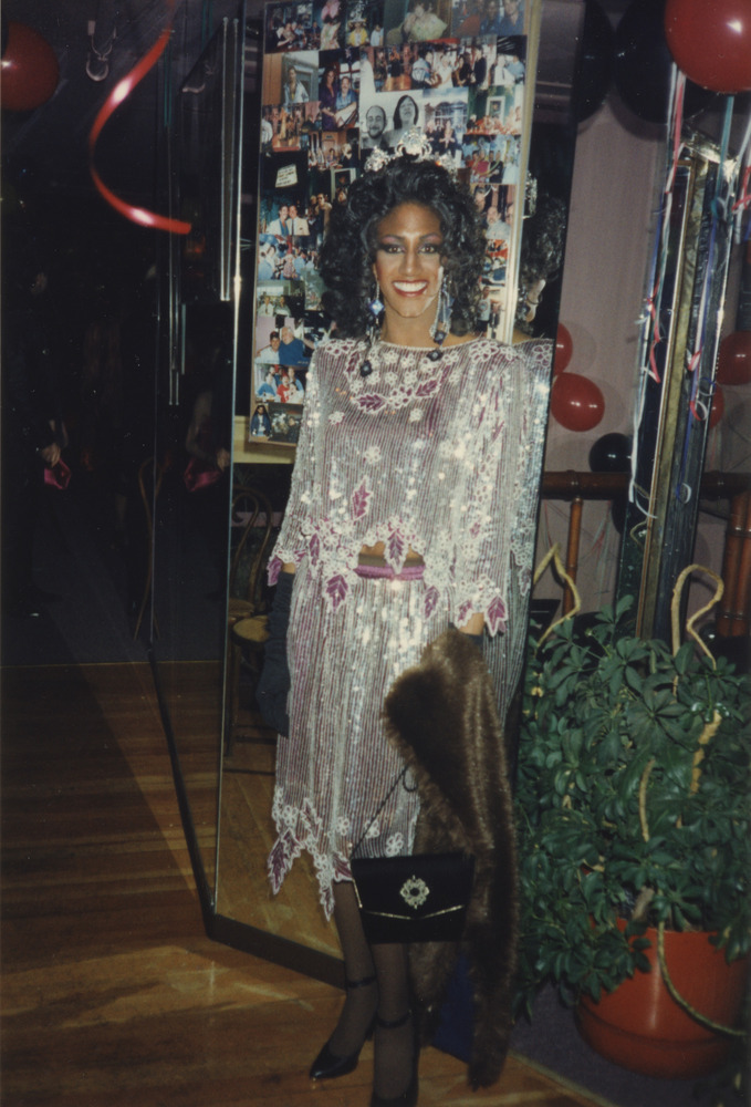 Download the full-sized image of Photograph of Person in Dark Magenta and White Sequinned Two-Piece Outfit
