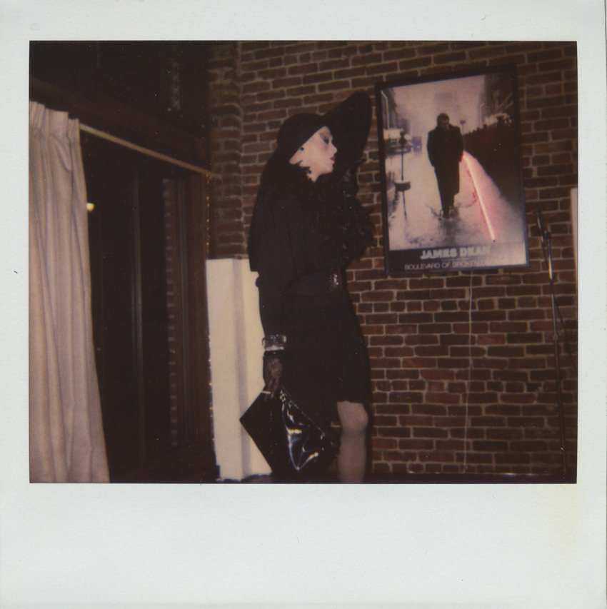 Download the full-sized image of Photograph of Person in Black Outfit and Large Hat