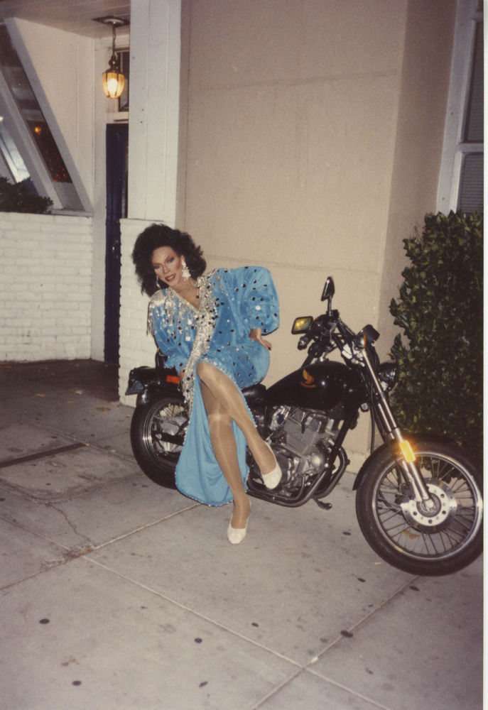 Download the full-sized image of Photograph of Person in Jeweled Blue Dress on Motorcycle