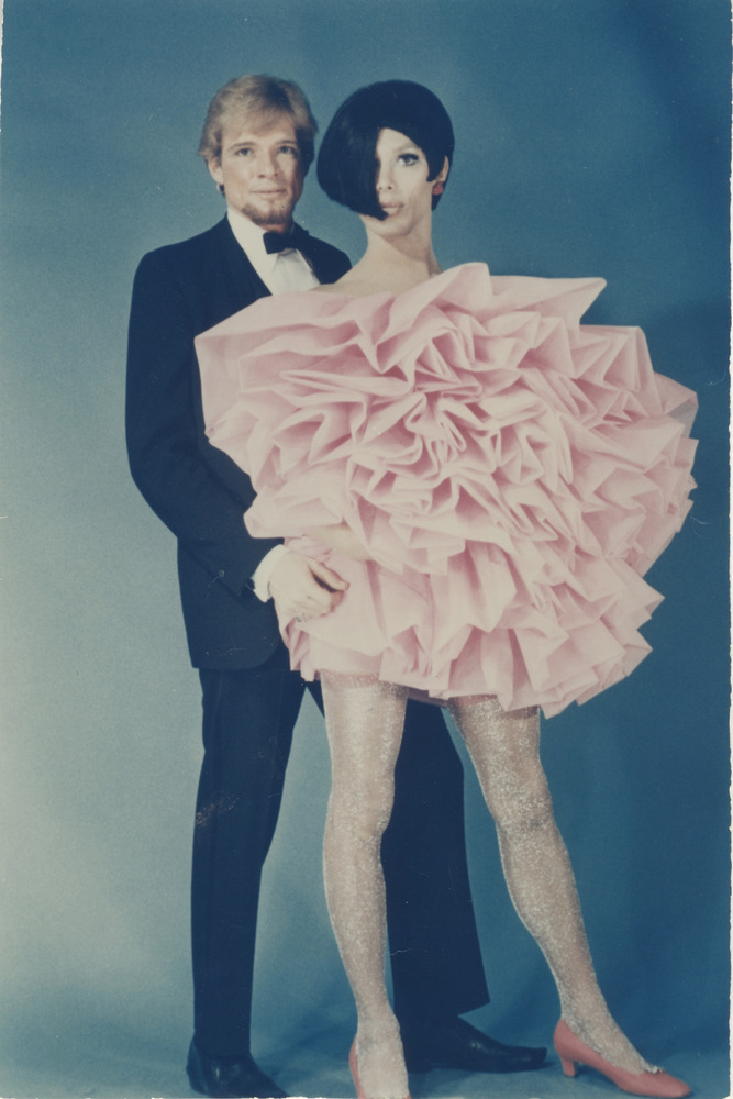 Download the full-sized PDF of Photograph of Alexis Francois in Pink Layered Dress With Person in Tuxedo