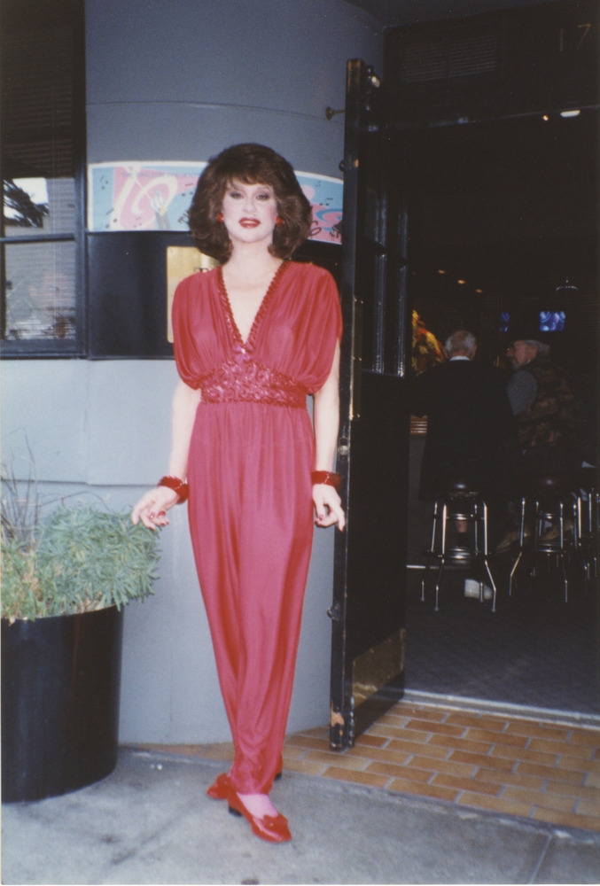 Download the full-sized image of Photograph of Alexis Francois in Red Dress in Front of Bar