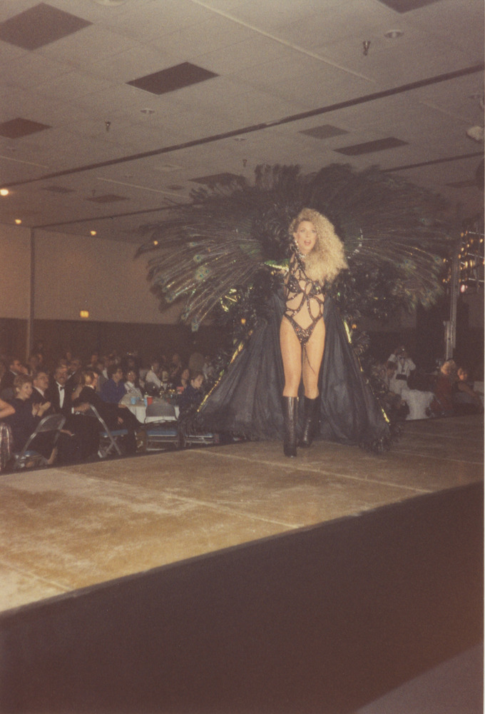 Download the full-sized image of Photograph of Person in Peacock Costume on Reno Stage
