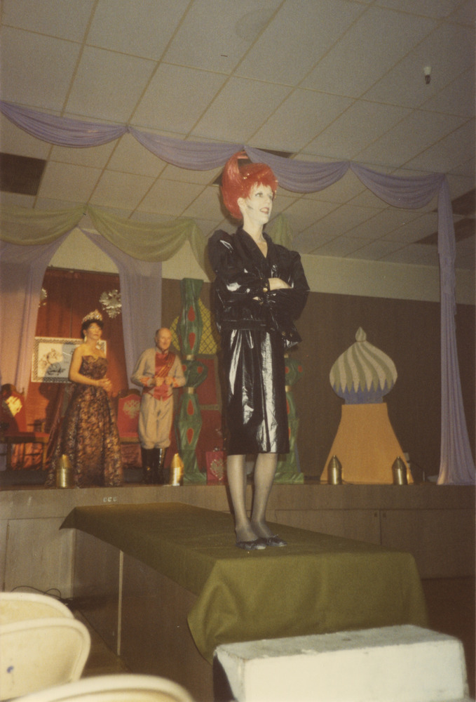 Download the full-sized image of Photograph of Person in Black Leather Costume and Red Wig