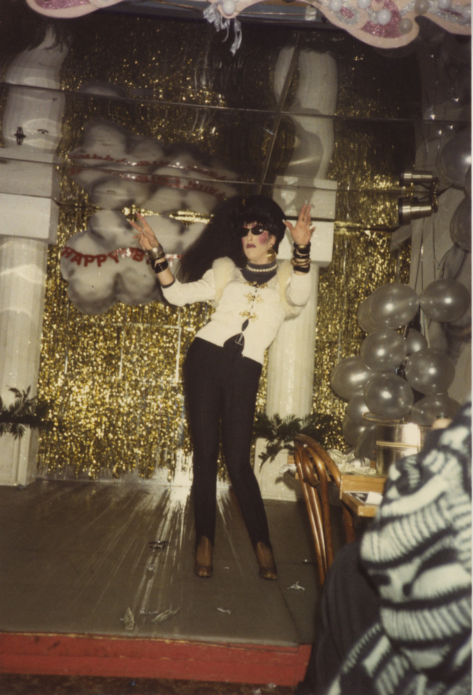Download the full-sized image of Photograph of Person on Stage in White and Black Suit