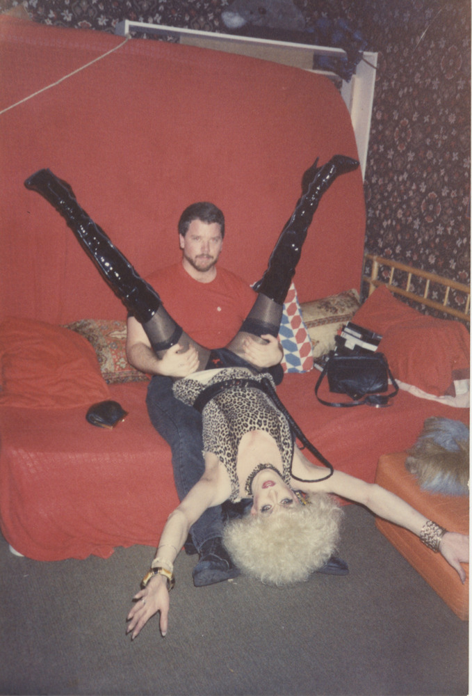 Download the full-sized image of Photograph of Person in Drag Upside Down Straddling a Man