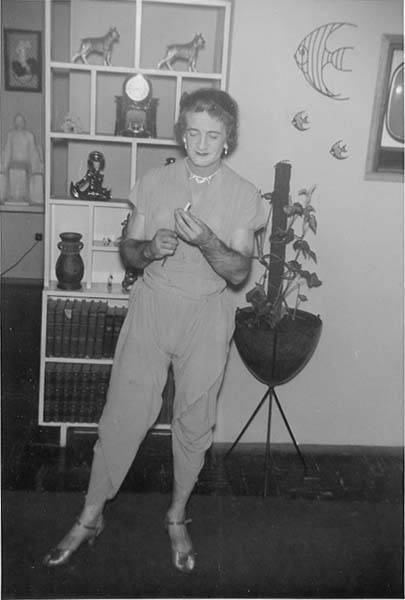 Download the full-sized image of Unknown femme in jumpsuit at a house party