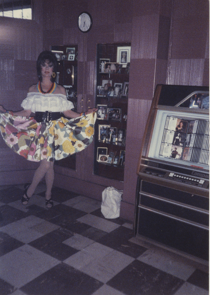 Download the full-sized image of Photograph of Alexis Francois in White Top and Floral Skirt